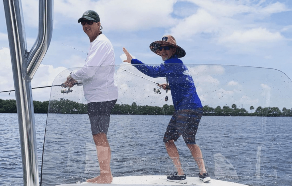 Bernie Saboe and friend enjoying fishing on 21 Ultra Elite boat